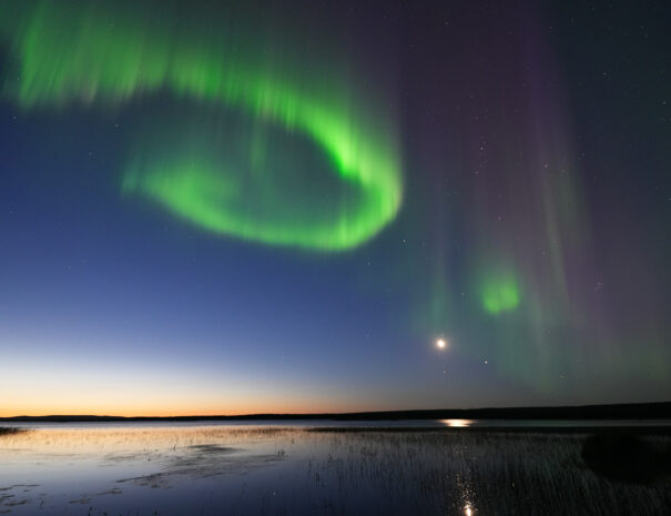 Aurora sunset from loghouse vika lapland